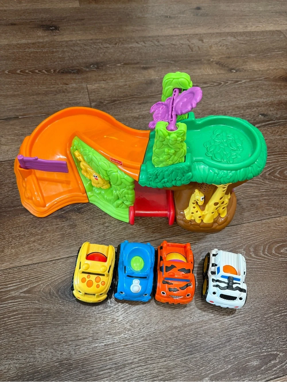 Fisher-Price Bright Green & Orange Jungle Slide Playset with Colorful Toy Cars